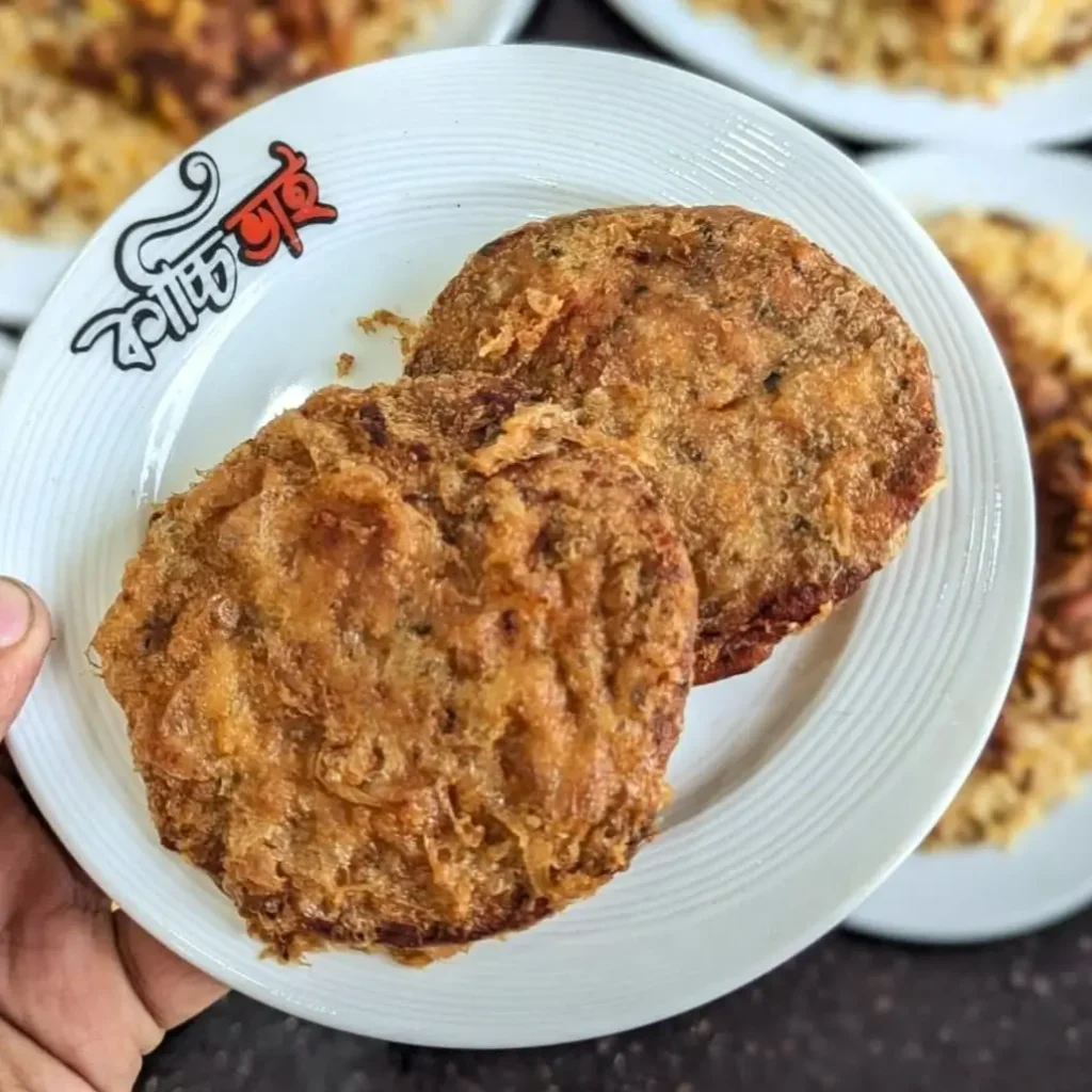 Chicken Jali Kabab served at Kacchi Bhai β crispy, golden brown, wrapped in egg net, priced at 70ΰ§³ and often paired with kacchi rice.